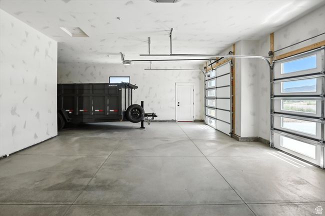 Garage with a garage door opener | Image 49