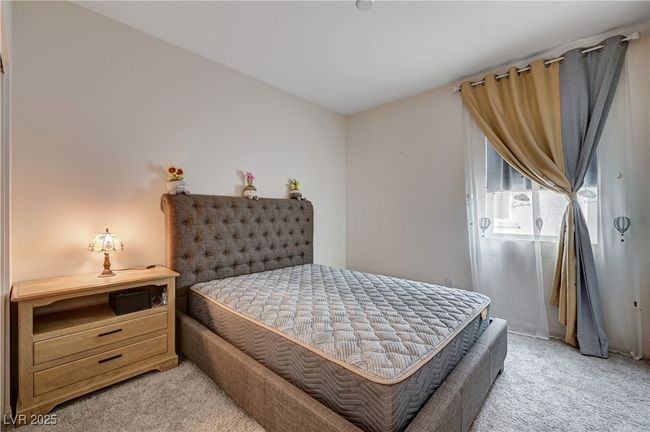 Bedroom with light colored carpet | Image 29