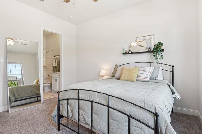 Bedroom featuring carpet flooring, ensuite bathroom, and ceiling fan | Image 32