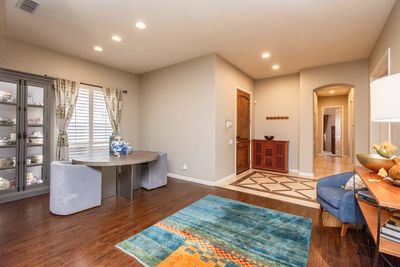 Notice the travertine entry tile. The 2nd and 3rd bedrooms are down the hall, giving separation from the master bedroom. this formal dining area has room to expand for a large gathering. You can see the office doors on the right side of the photo. | Image 2