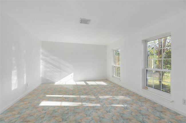Looking to the right, is a large family room | Image 4