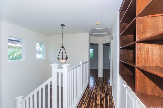 Upstairs hallway with built in shelves. | Image 14