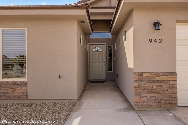 Property entrance featuring stone siding and stucco siding | Image 8