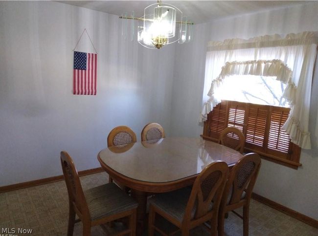 Dining space featuring a chandelier | Image 4