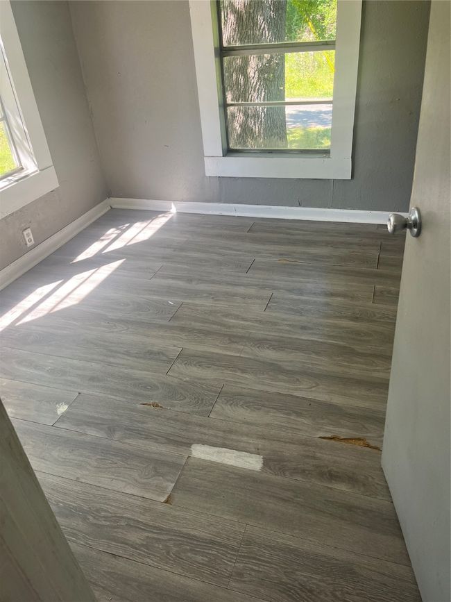 Empty room featuring wood finished floors and baseboards | Image 5