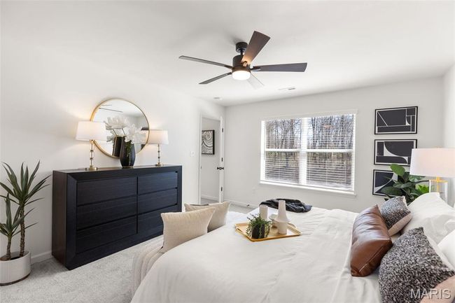 Carpeted bedroom with baseboards and a ceiling fan | Image 17