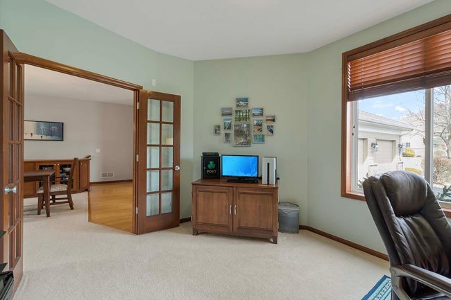 Glassed French doors lead to the home office. | Image 18