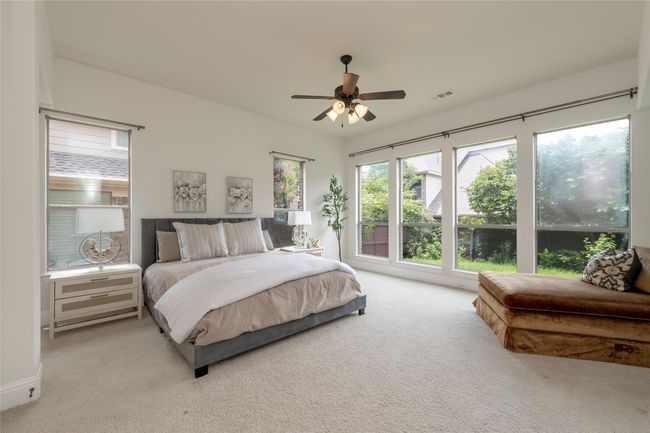 Carpeted bedroom with ceiling fan | Image 16