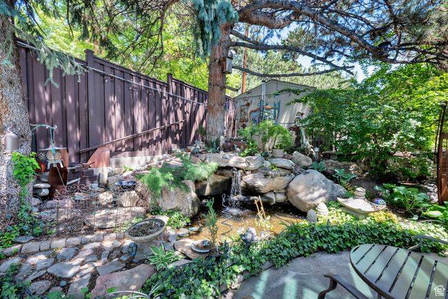 View of yard with a small pond | Image 38