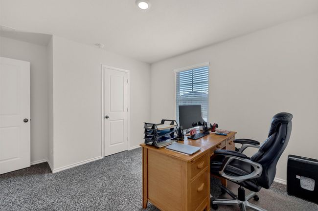 Office area with carpet floors and baseboards | Image 25