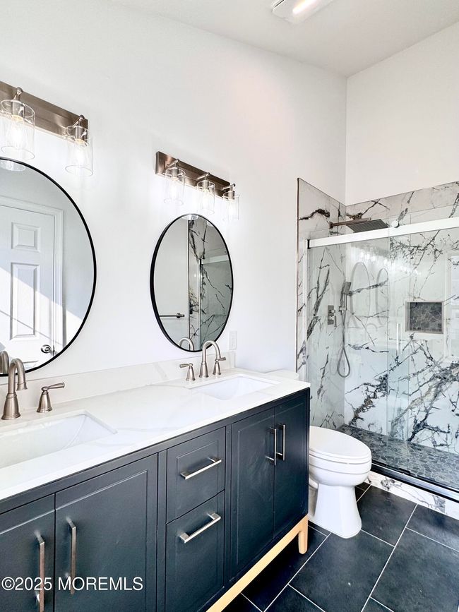 Primary bath looking towards walk in shower with custom tile | Image 22