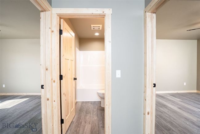 Hallway to guest bedrooms and guest bathrrom | Image 14