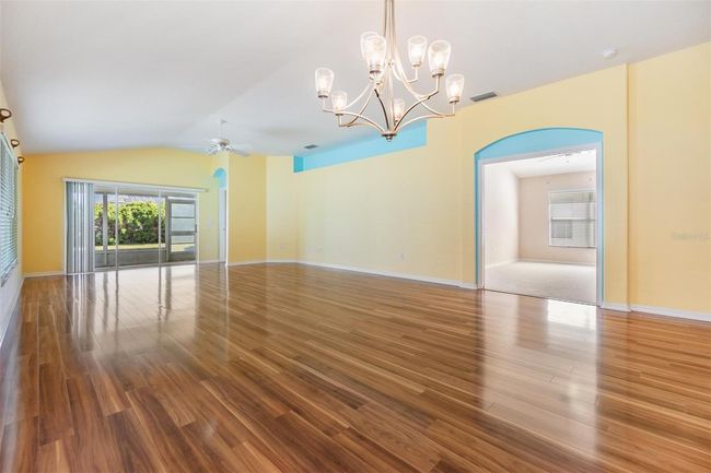 Dining area offers lanai and backyard views | Image 8