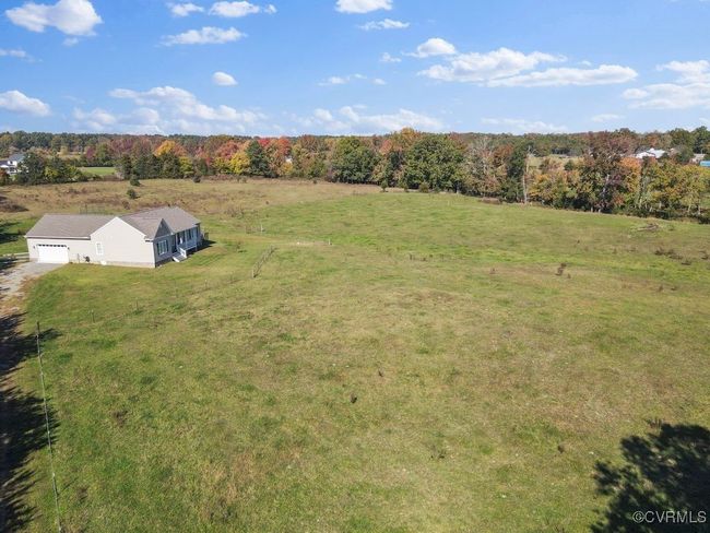 Aerial view featuring a forest view | Image 23