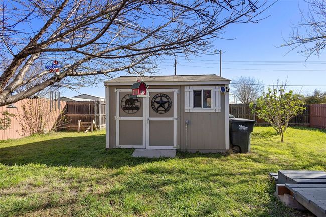 View of shed with a fenced backyard | Image 34