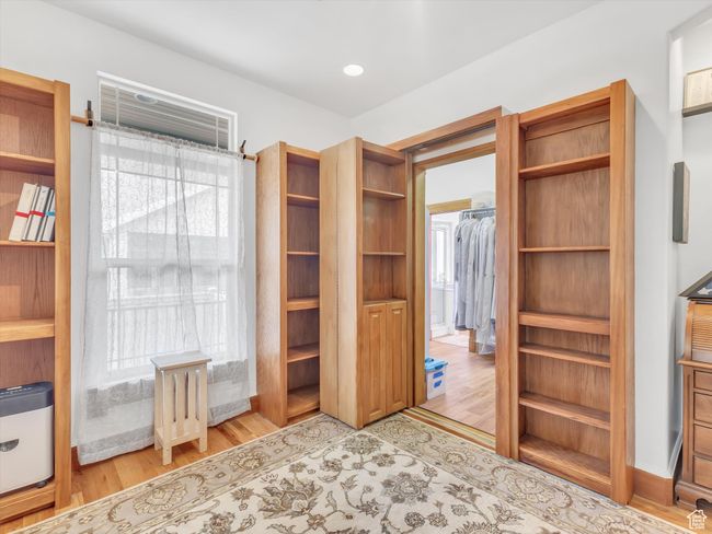 Walk in closet with light wood-type flooring | Image 19