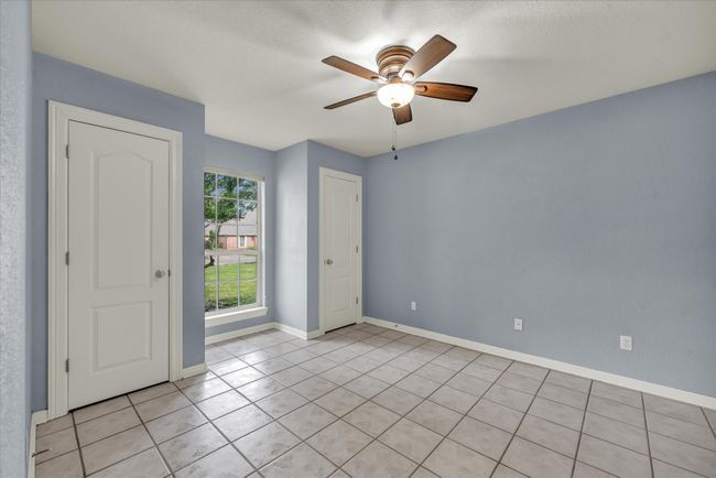 Unfurnished room featuring light tile patterned floors and a ceiling fan | Image 19