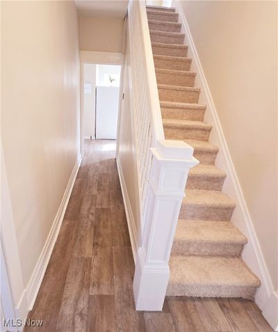 Entry foyer with new laminate and carpet for steps | Image 2