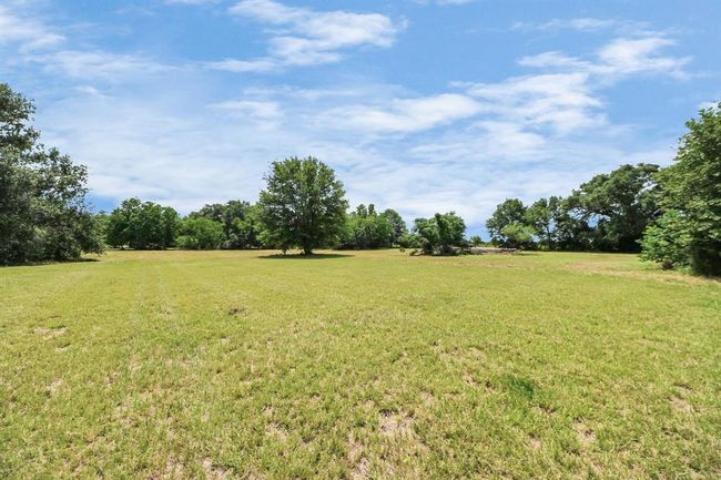 Additional open acreage beyond the fenced yard—perfect for horses, trails, or your dream barn. | Image 34