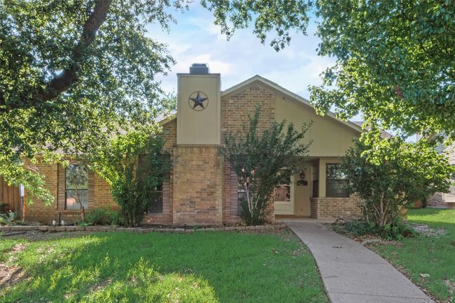View of front of home featuring brick siding, a front yard, and a chimney | Image 13