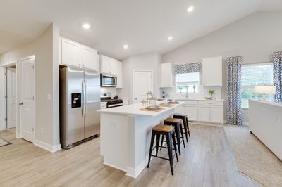 Welcome home to this spectacular Cameron II Floorplan! Entertain your guests in your very own spacious kitchen. Photo of Model Home. Options and colors may vary. | Image 2