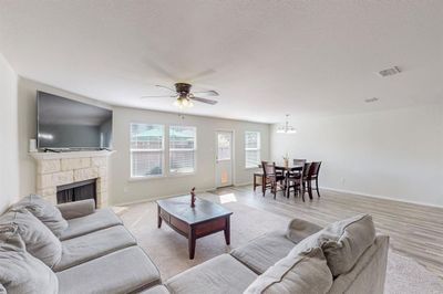 Main Living with lots of natural lighting and upgraded stone fireplace | Image 3