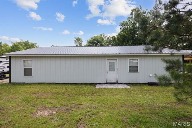 Back of house featuring metal roof and a yard | Image 26