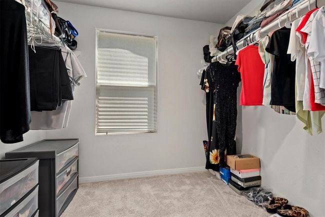 Walk in closet in Primary Bedroom | Image 14