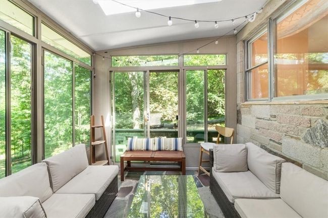 Sunroom featuring track lighting and vaulted ceiling | Image 13