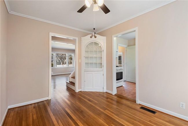 Another view of the dining room showing how it opens to both the living room and kitchen | Image 5