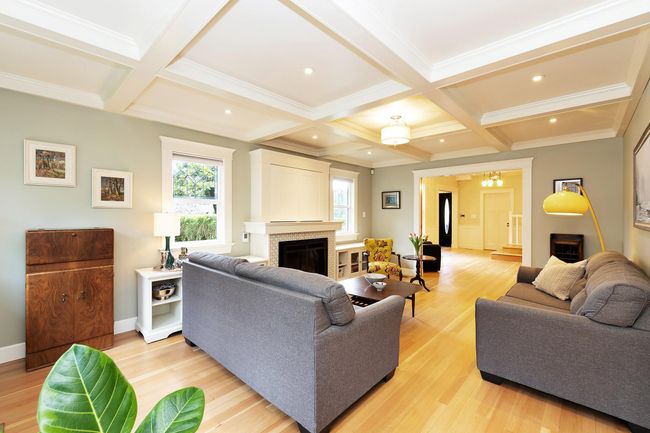 Living room featuring beam ceiling, a fireplace, and coffered ceiling | Image 4