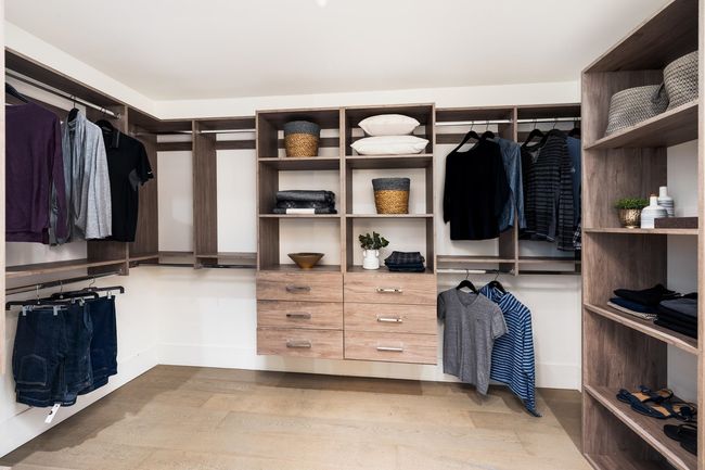 Walk in closet featuring wood finished floors | Image 25