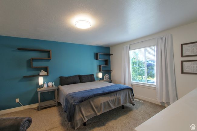 Bedroom with carpet floors | Image 15