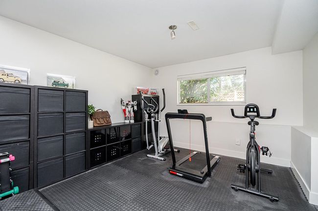 Workout area with carpet flooring and baseboards | Image 23