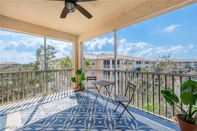 Covered, screened lanai featuring ceiling fan | Image 19