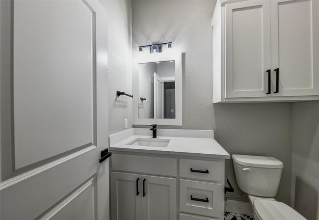 Bathroom featuring vanity and toilet | Image 30