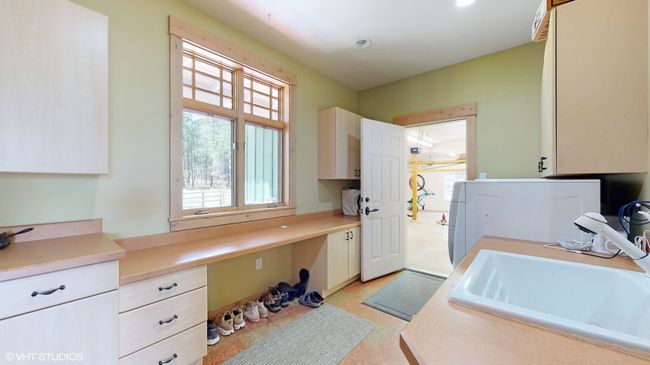 Main Home Laundry and Garage Access Main Floor | Image 41
