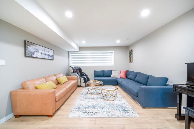 Living room with light wood finished floors, baseboards, and recessed lighting | Image 25