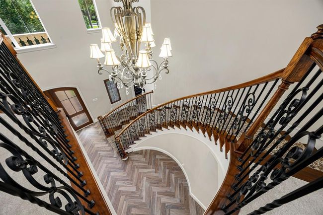 Elegant winding staircase is showcased in this stunning five-bedroom home! | Image 27