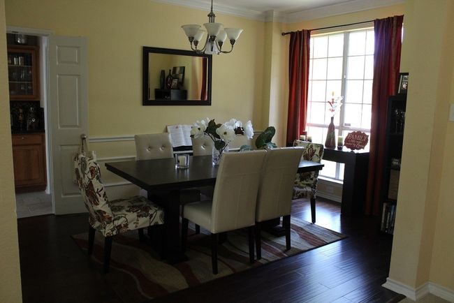 Dining space featuring a chandelier, ornamental molding, and dark wood finished floors | Image 6