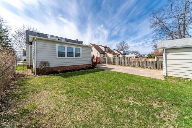 Rear view of house featuring a yard | Image 37