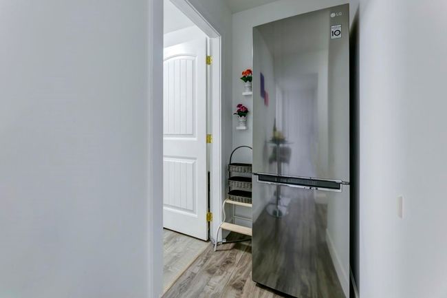 Hall with light wood finished floors and baseboards | Image 20