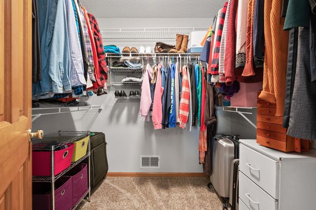 The walk-in closet in the master suite is AMAZING! The built-in shelves are a great addition and will help ensure your wardrobe stays organized. | Image 23