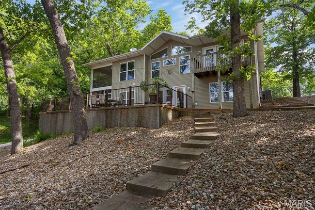 View of front facade with a balcony and stairs | Image 28