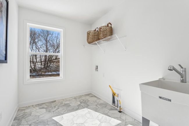 Photo is of the actual model. Convenient upper level laundry. | Image 28