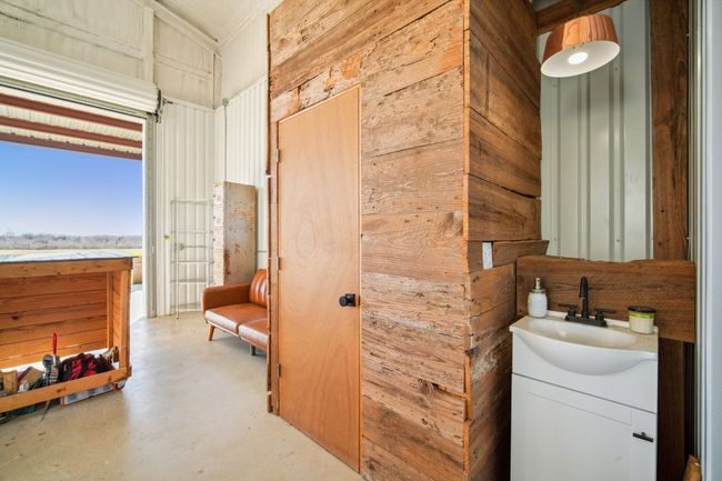 Private half bath tucked behind that door - with handwashing for all. | Image 21