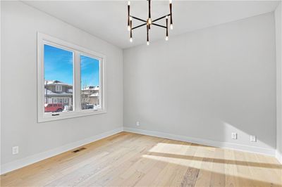 Formal Dining R0om featuring light hardwood / wood-style floors and a chandelier | Image 3