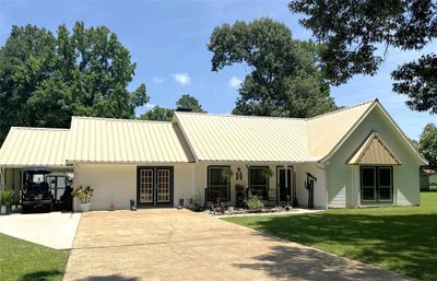 View from the front of the home! The french doors take you into the converted garage space that can be used in so many different ways. | Image 1