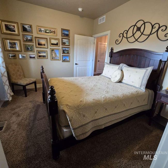 Carpeted bedroom with baseboards | Image 11