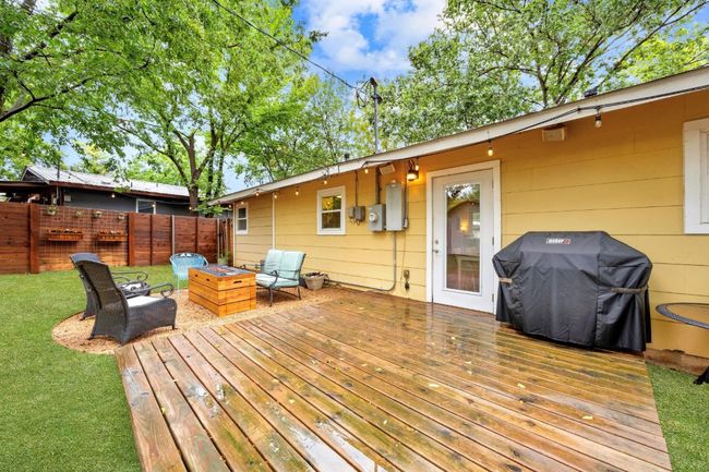 Wooden deck with grilling area and a fire pit | Image 22